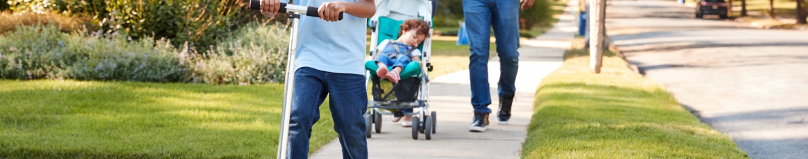 a family walking on a curb