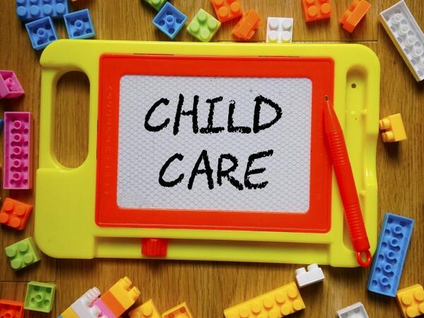 'child care' written on toy slate