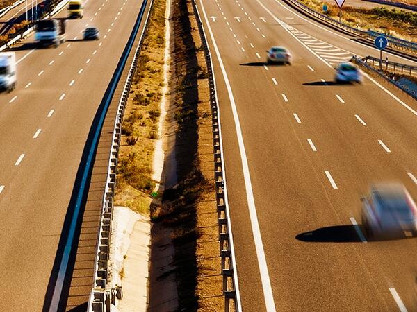 a highway with some cars