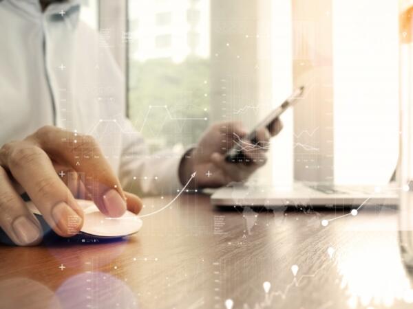 person operating mouse on a desk